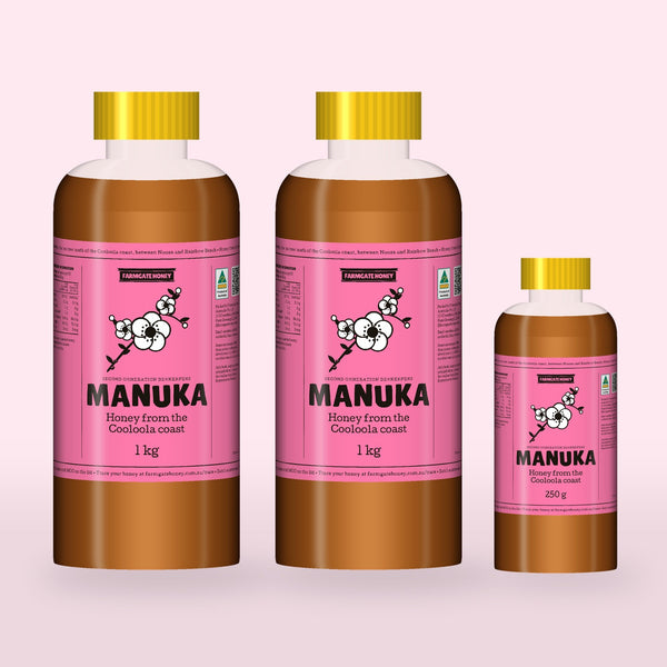 Two 1kg bottles and a 250g bottle of Queensland Manuka Honey with the pink manuka label (a render of the new label, coming this season)
