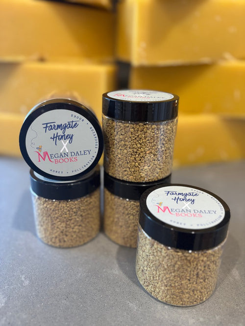 Jars of bee pollen with the Farmgate Honey x Megan Daley Books label