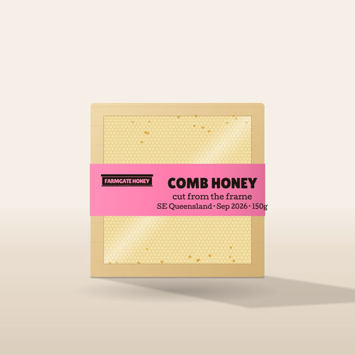 Comb honey in a timber section with the pink Farmgate Honey band (test label, coming this season)