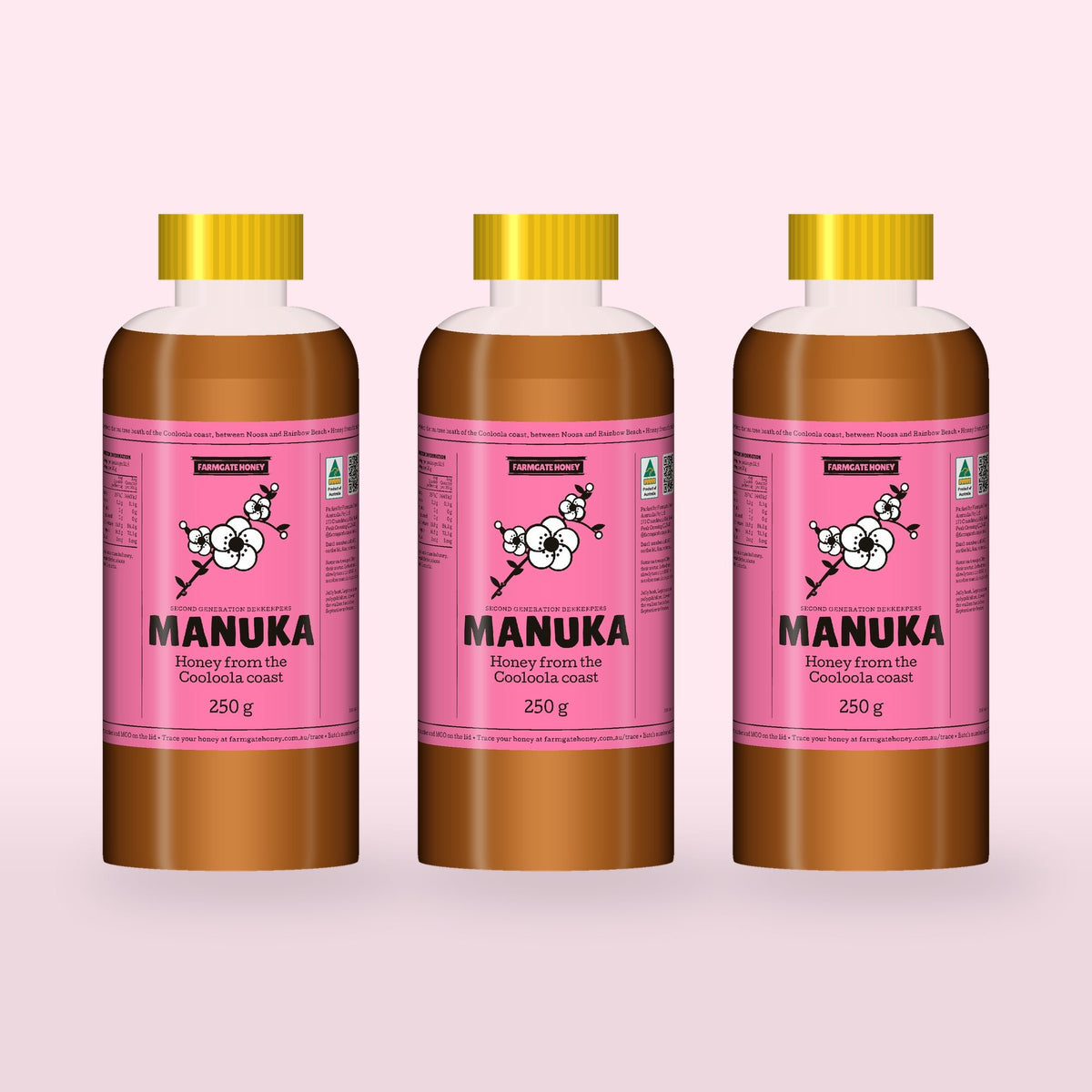 Three 250g bottles of Queensland Manuka Honey with the pink manuka label (a render of the new label, coming this season)