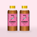 Two 500g bottles of Queensland Manuka Honey with the pink manuka label (a render of the new label, coming this season)
