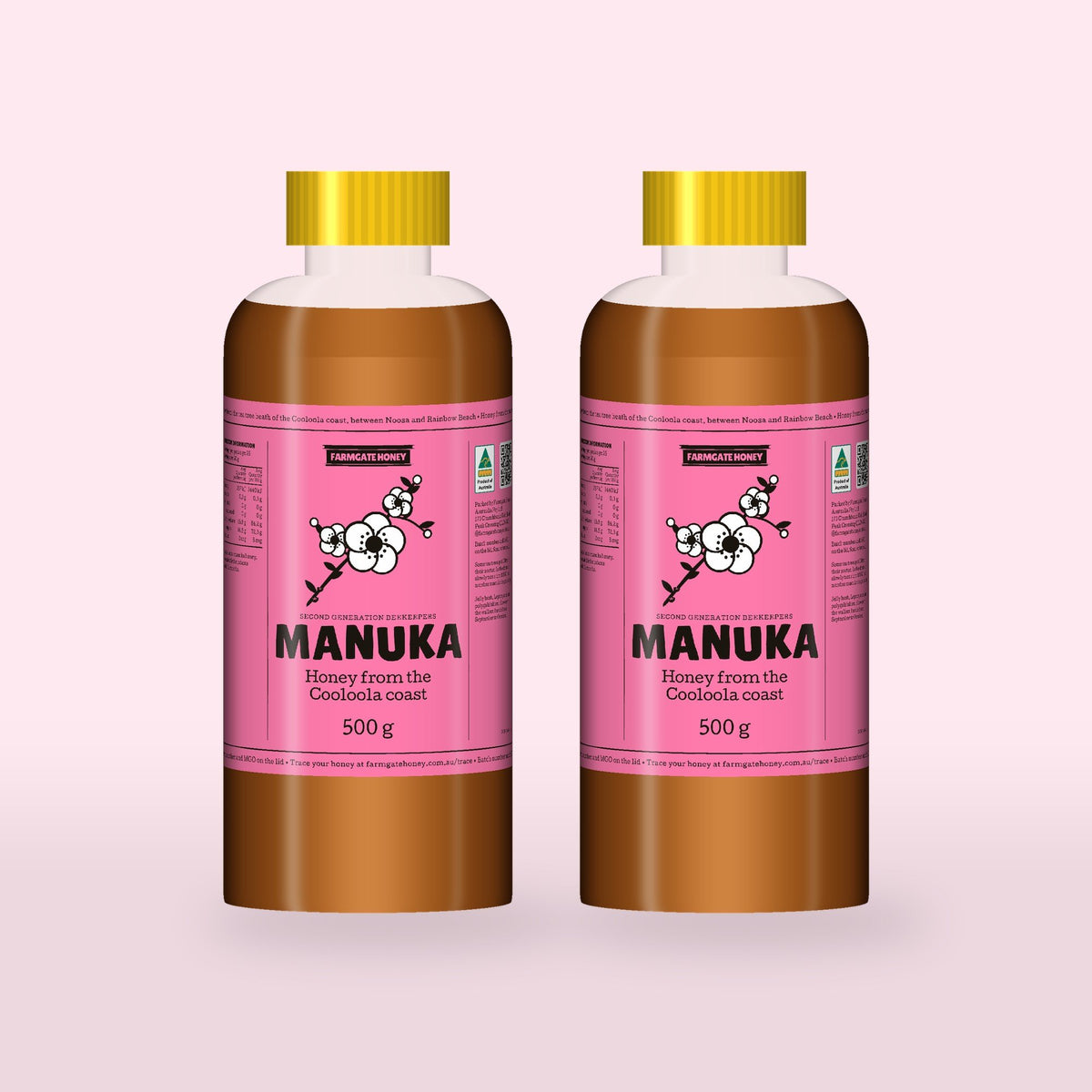 Two 500g bottles of Queensland Manuka Honey with the pink manuka label (a render of the new label, coming this season)