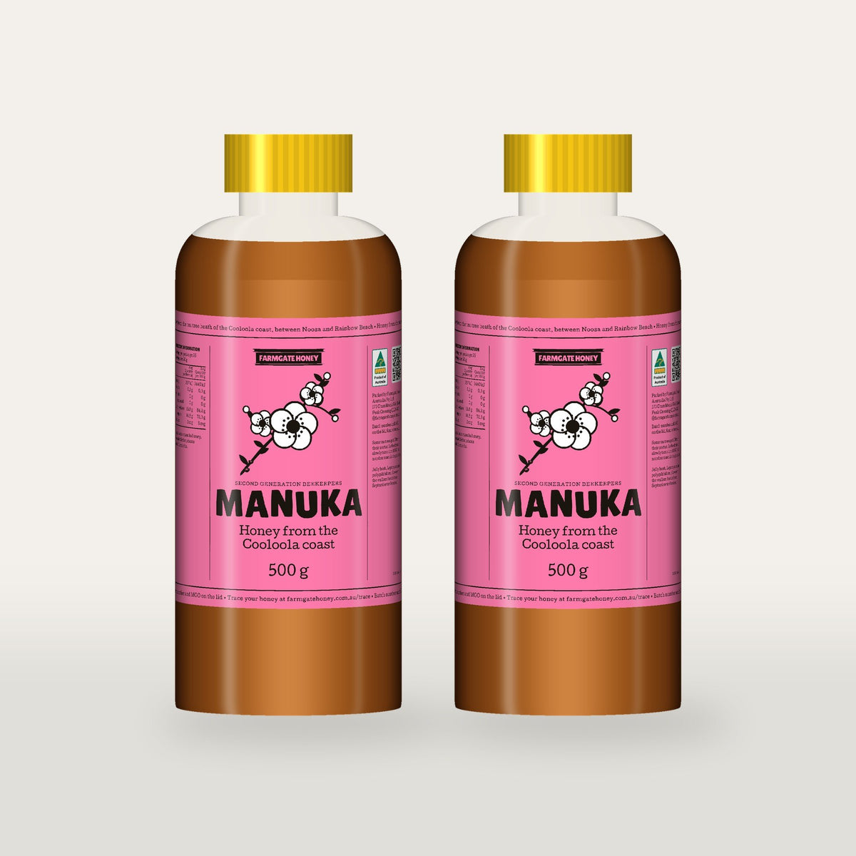 Two 500g bottles of Queensland Manuka Honey with the pink manuka label (a render of the new label, coming this season)