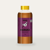 Queensland Manuka Honey in a clear squeeze bottle, the pink manuka label with a flowering tea tree drawn on the front (a render of the new label, coming this season)