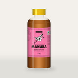 Queensland Manuka Honey in a clear squeeze bottle, the pink manuka label with a flowering tea tree drawn on the front (a render of the new label, coming this season)