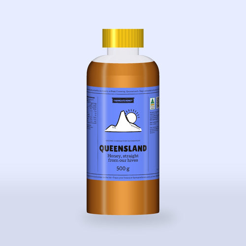 Queensland Honey in a clear squeeze bottle, cornflower label with Flinders Peak drawn on the front (a render of the new label, coming this season)