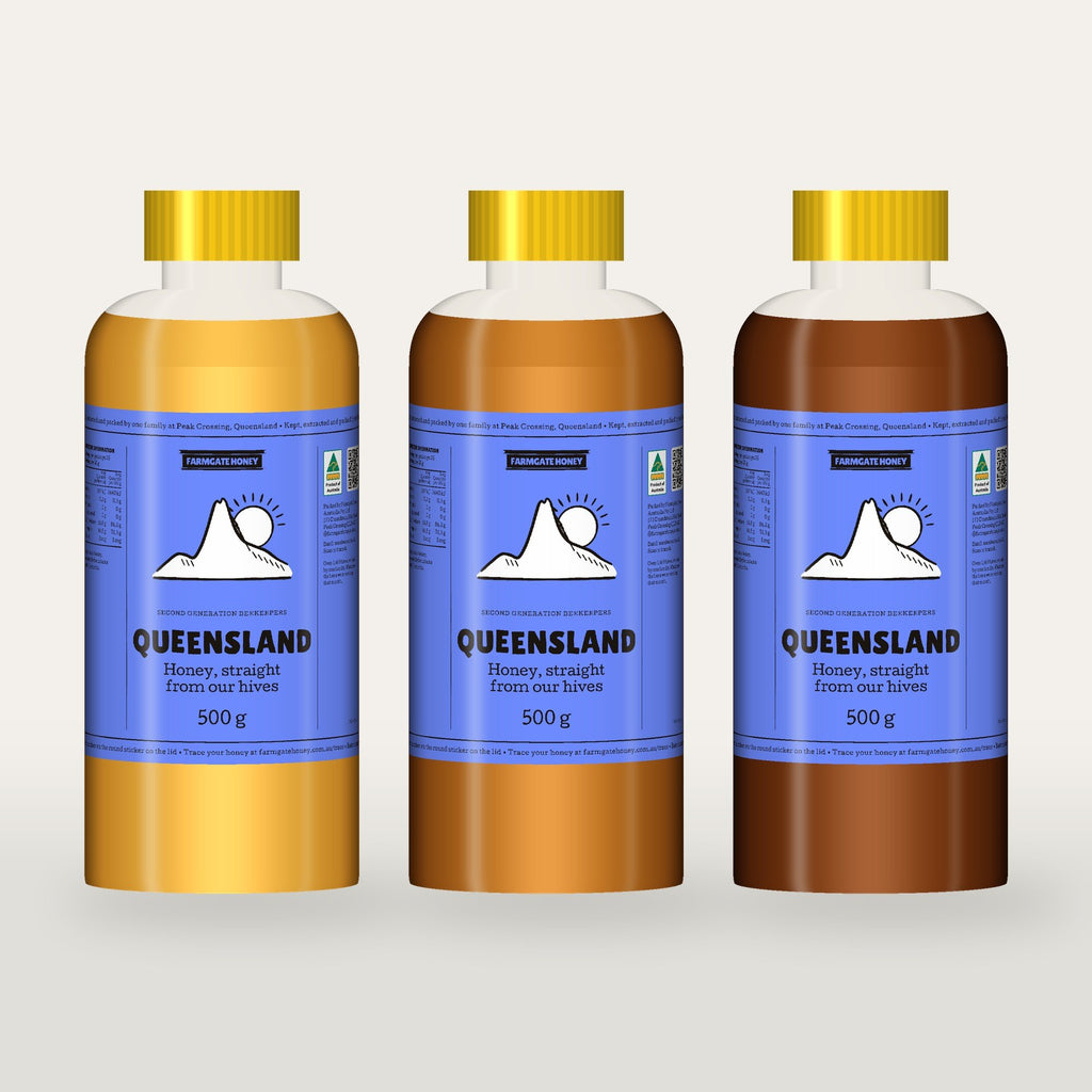 Three bottles of Queensland Honey, light, mid and dark, each with the cornflower Flinders Peak label (a render of the new label, coming this season)