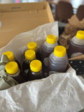 Farmgate Honey bottles with yellow caps packed in a box