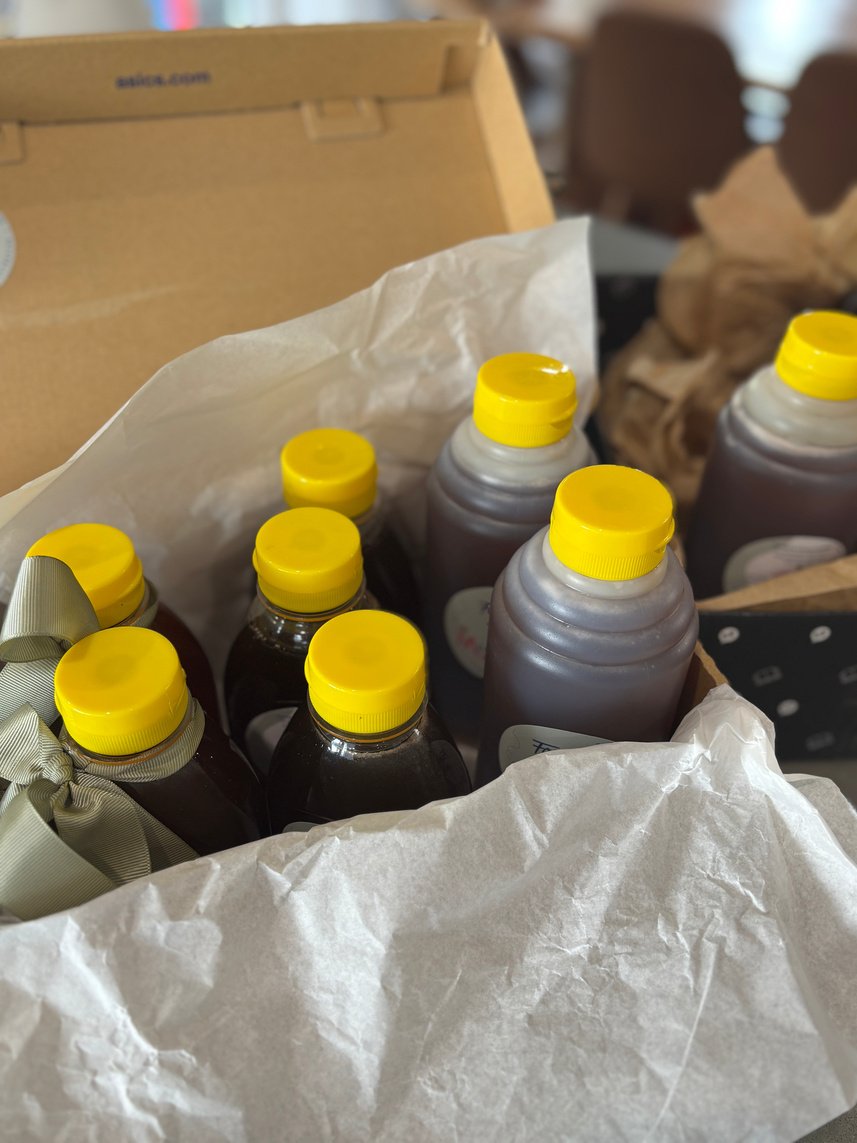 Farmgate Honey bottles with yellow caps packed in a box
